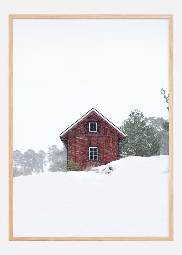 Old red house during snowstorm Poszter